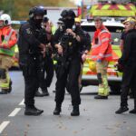 Police say one victim possibly shot by officer during Manchester attack 